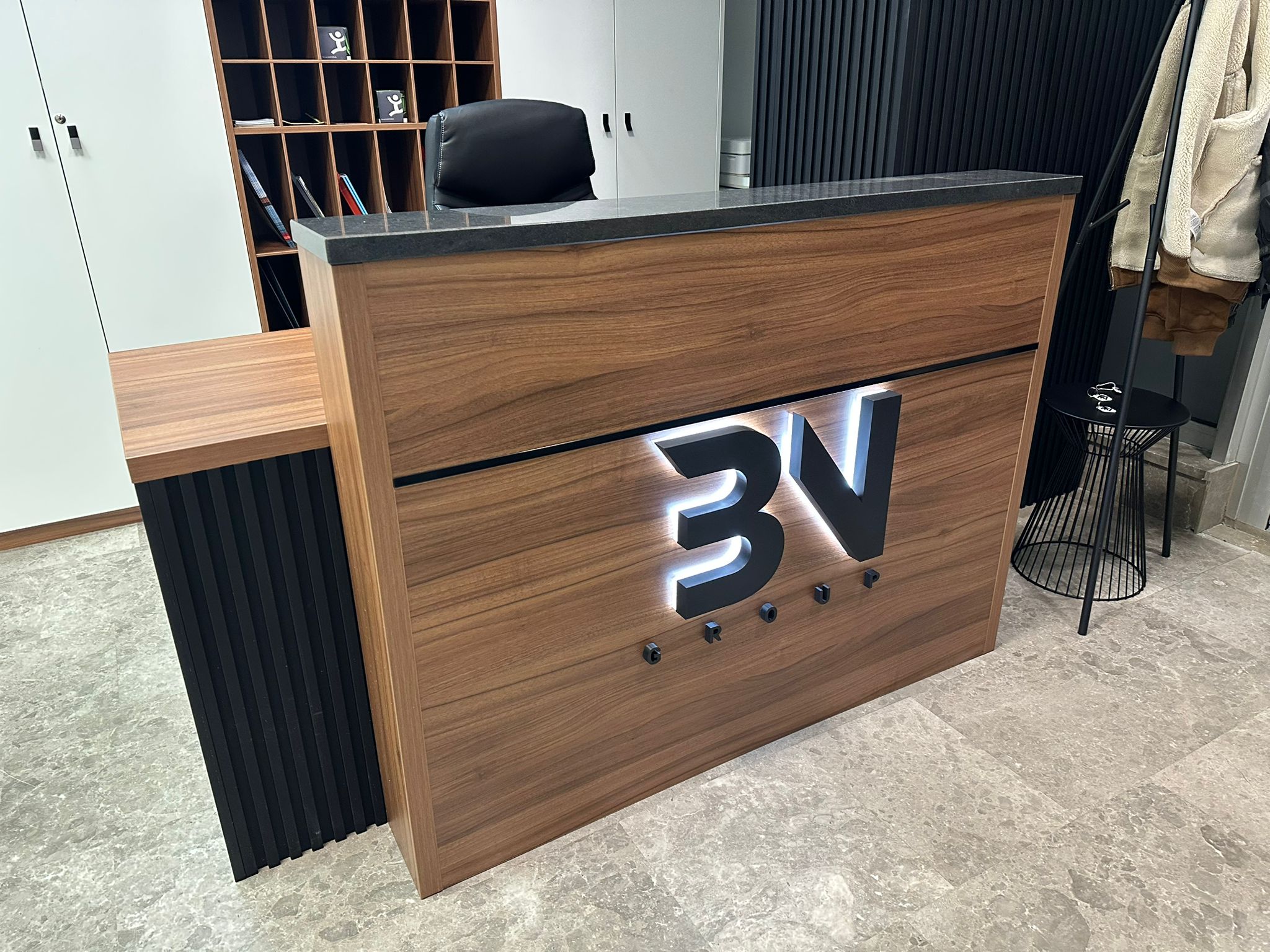 3V Group reception back-lit logo