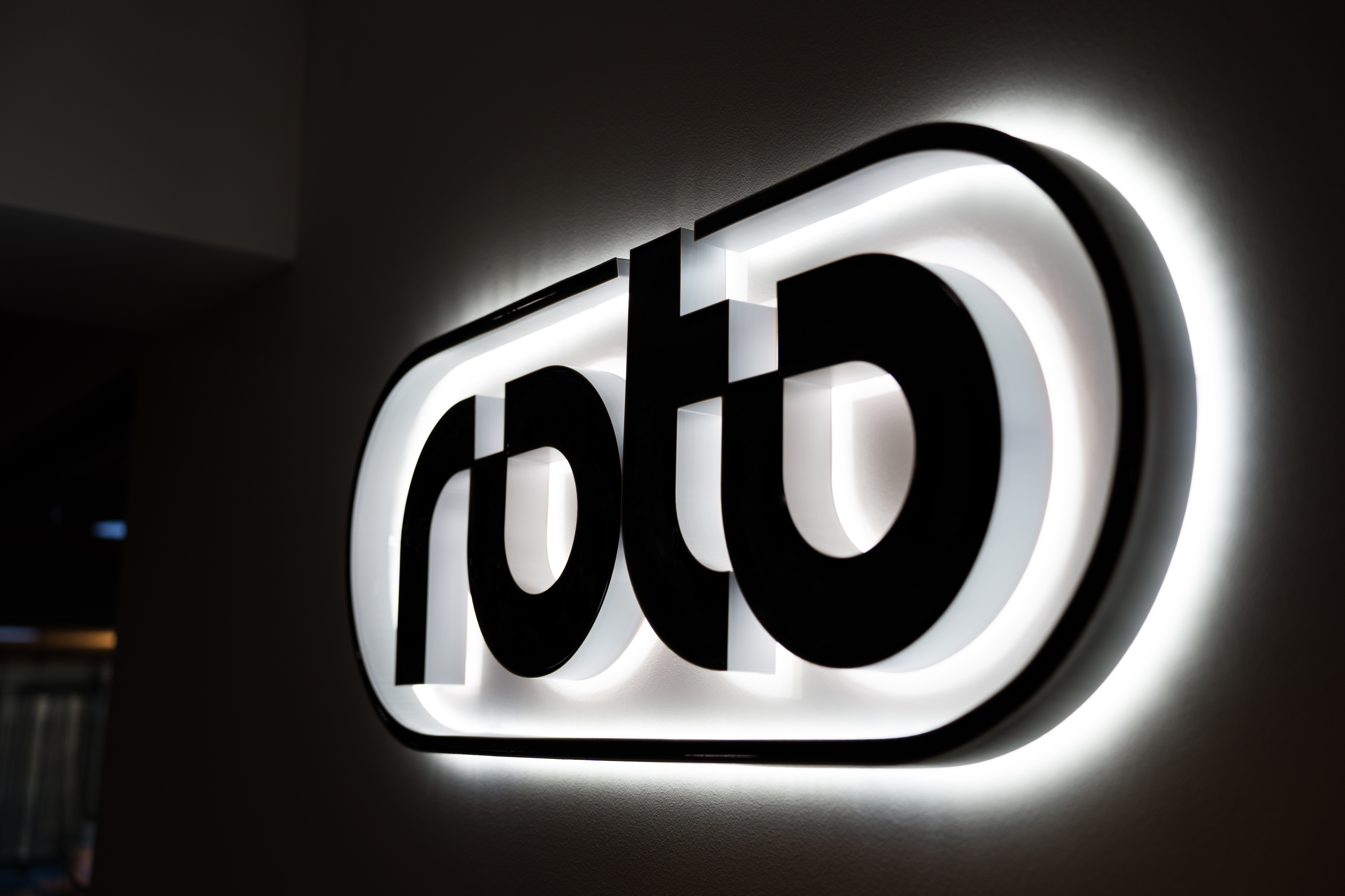 Roto back-lit dimensional logo