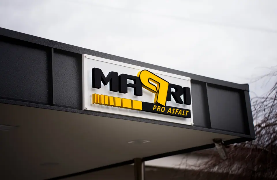 Mapri Pro Asfalt facade sign on a black cladded building