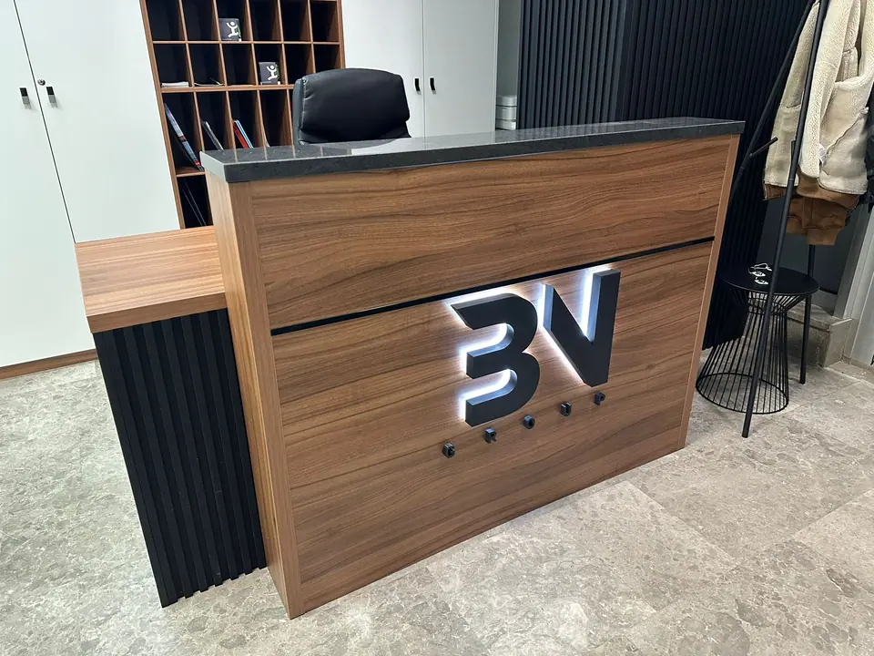 3V Group back-lit logo on reception desk