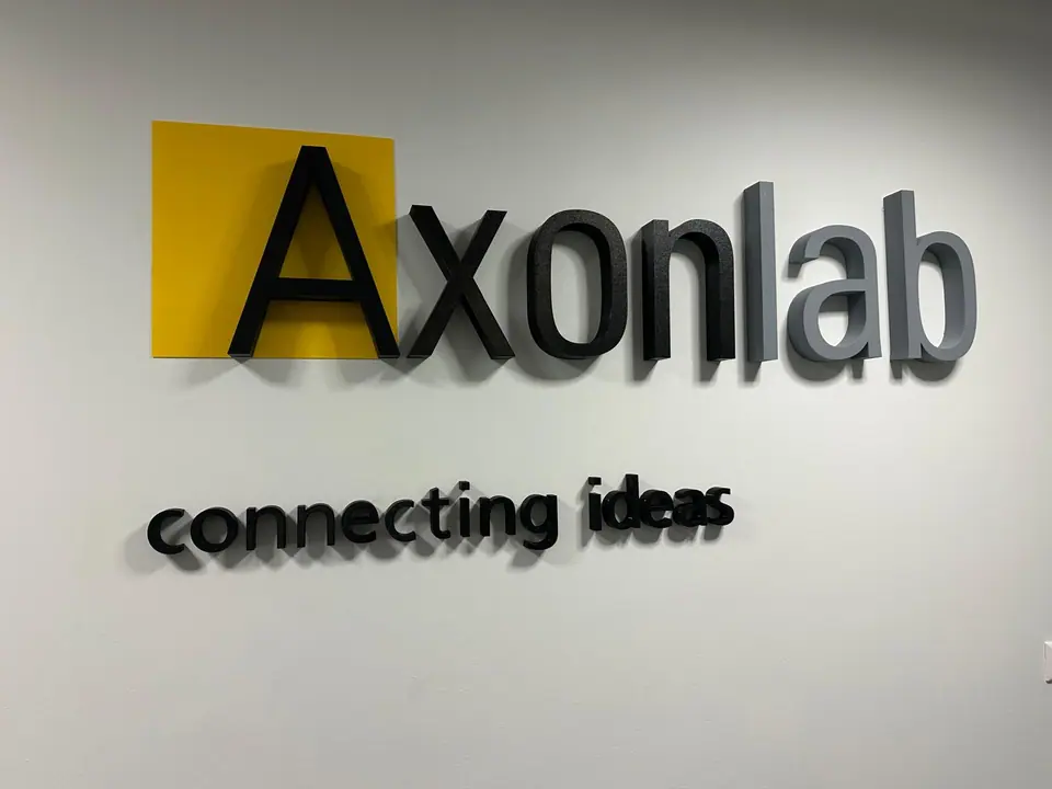 Axonlab dimensional logo on a reception wall