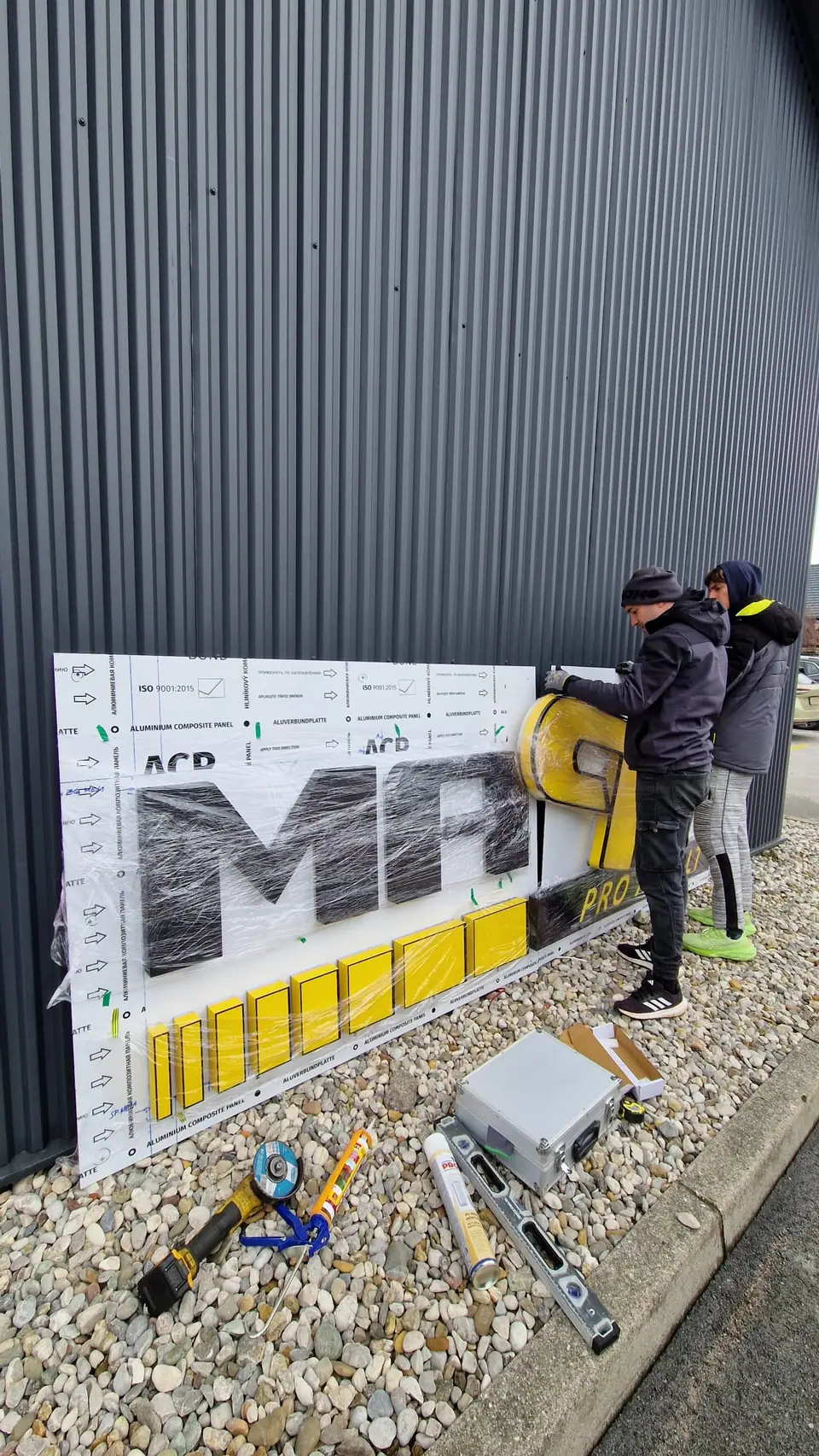 Our team assembling the Mapri sign lettering on site